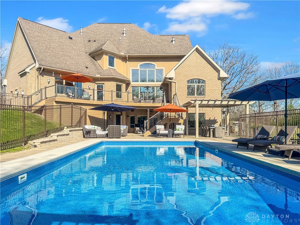 4096 Middle Urbana Road Urbana, OH 43078 - Photo 85 of 96 This grand residence offers an expansive outdoor oasis with a sparkling pool and multiple entertaining areas.