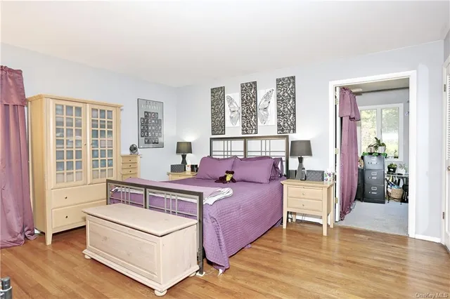 a bed room with a bed and a chair