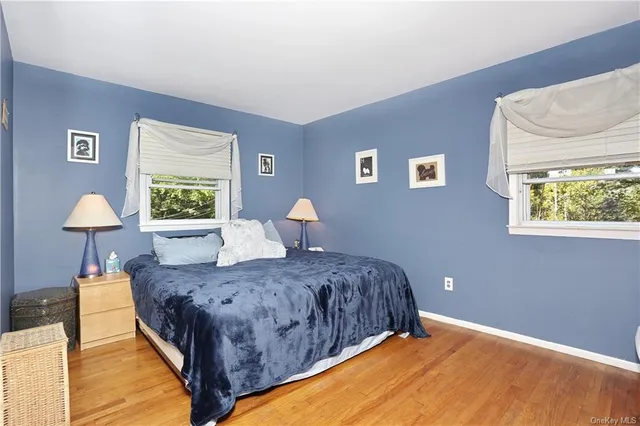 a bedroom with a bed and a lamp