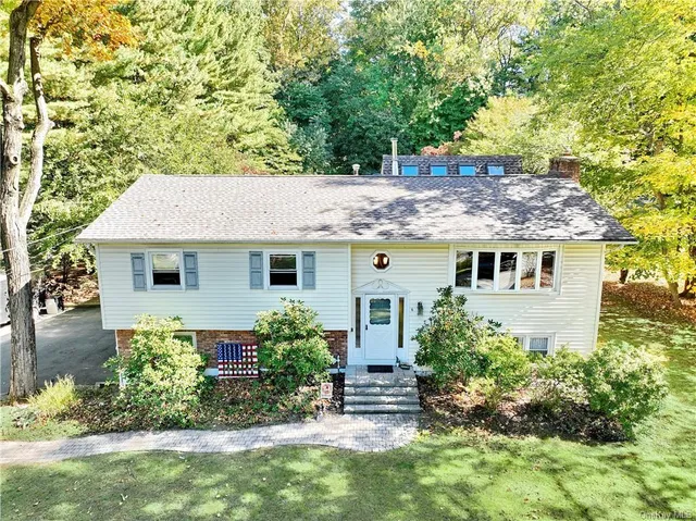 a view of a house with garden and plants