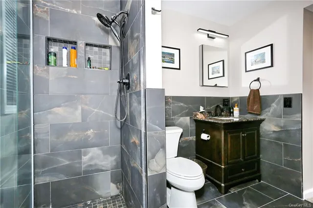 a bathroom with a sink toilet and vanity