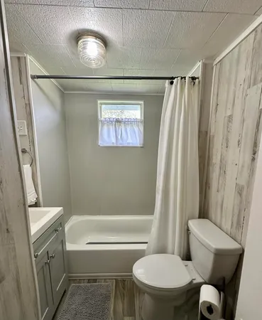 a bathroom with a sink a mirror and a shower