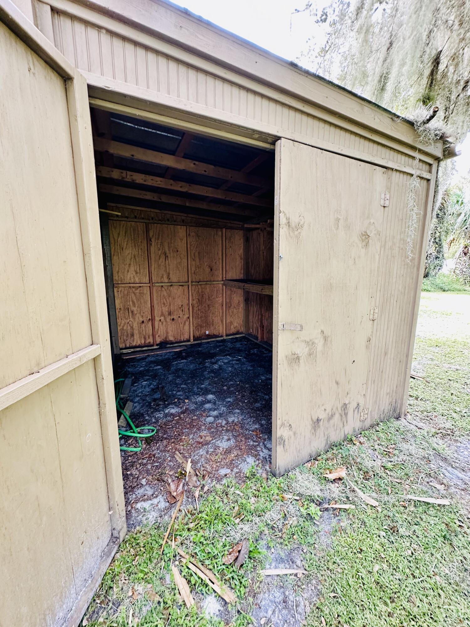 1104 Southwest 11th Street Okeechobee, FL 34974 - Photo 53 of 59 Shed 2 attached mower shed