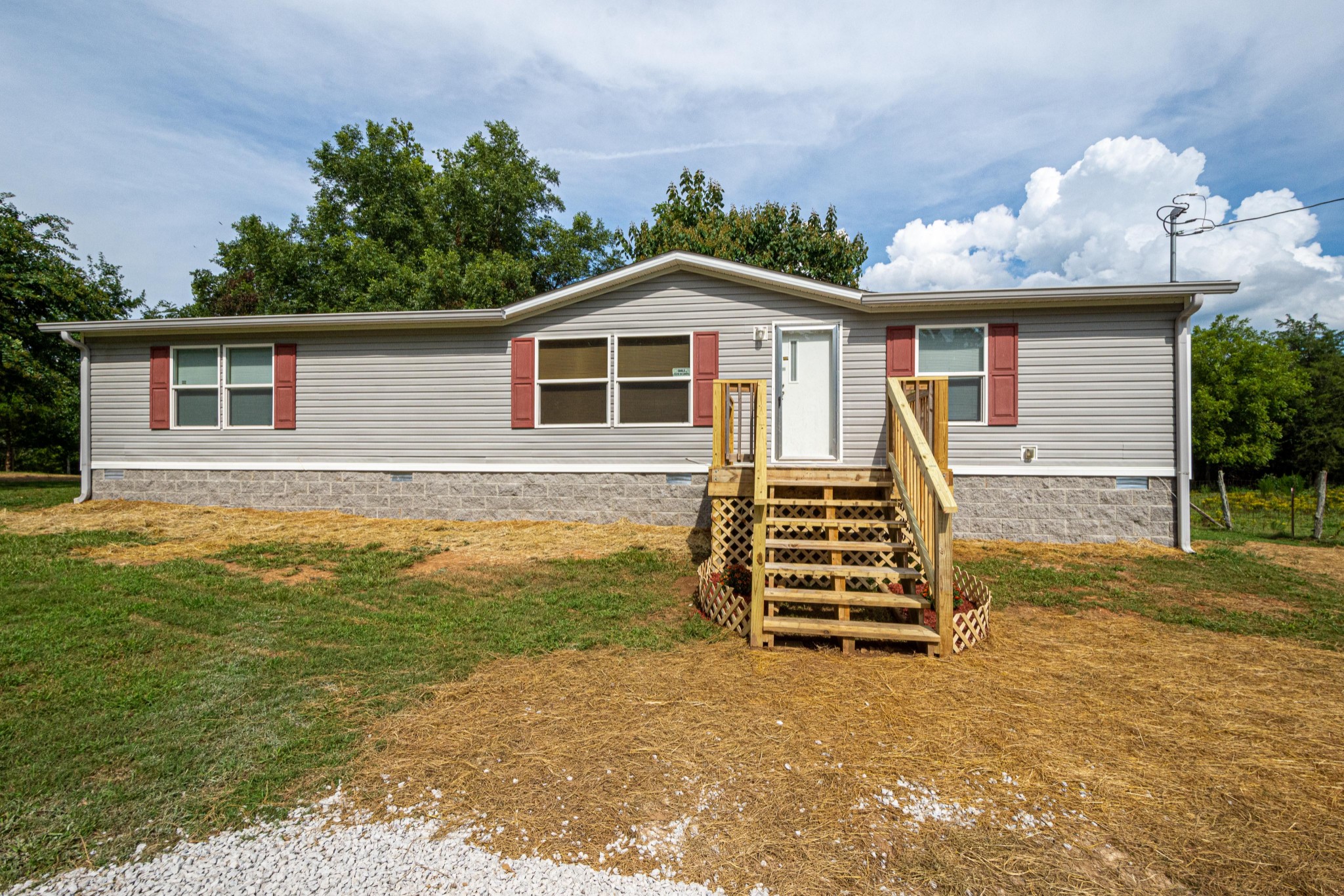 765 Crooked Hill Road Pulaski, TN 38478 - Photo 1 of 50 a front view of a house with a yard