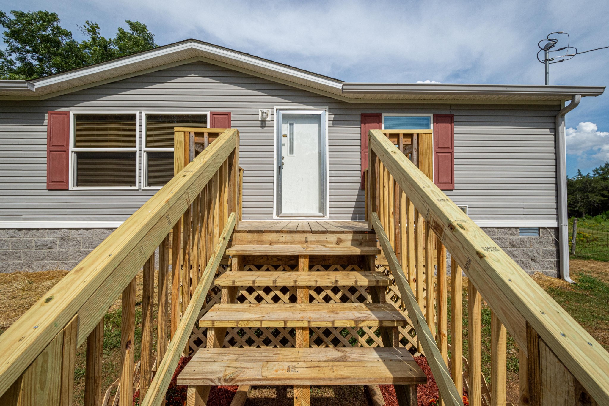 765 Crooked Hill Road Pulaski, TN 38478 - Photo 14 of 50 a view of a house with wooden stairs and stairs