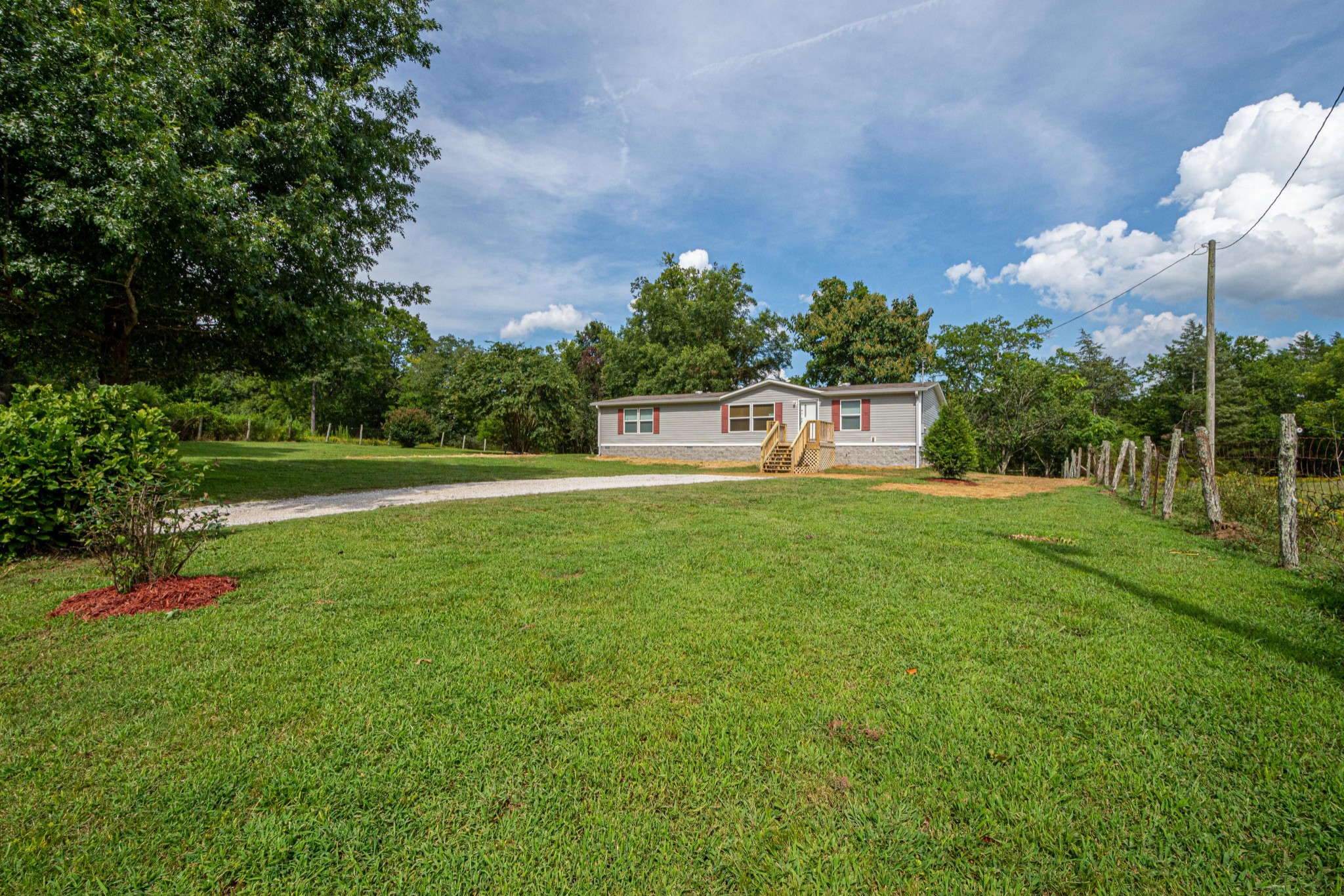 765 Crooked Hill Road Pulaski, TN 38478 - Photo 3 of 50 a house view with a garden
