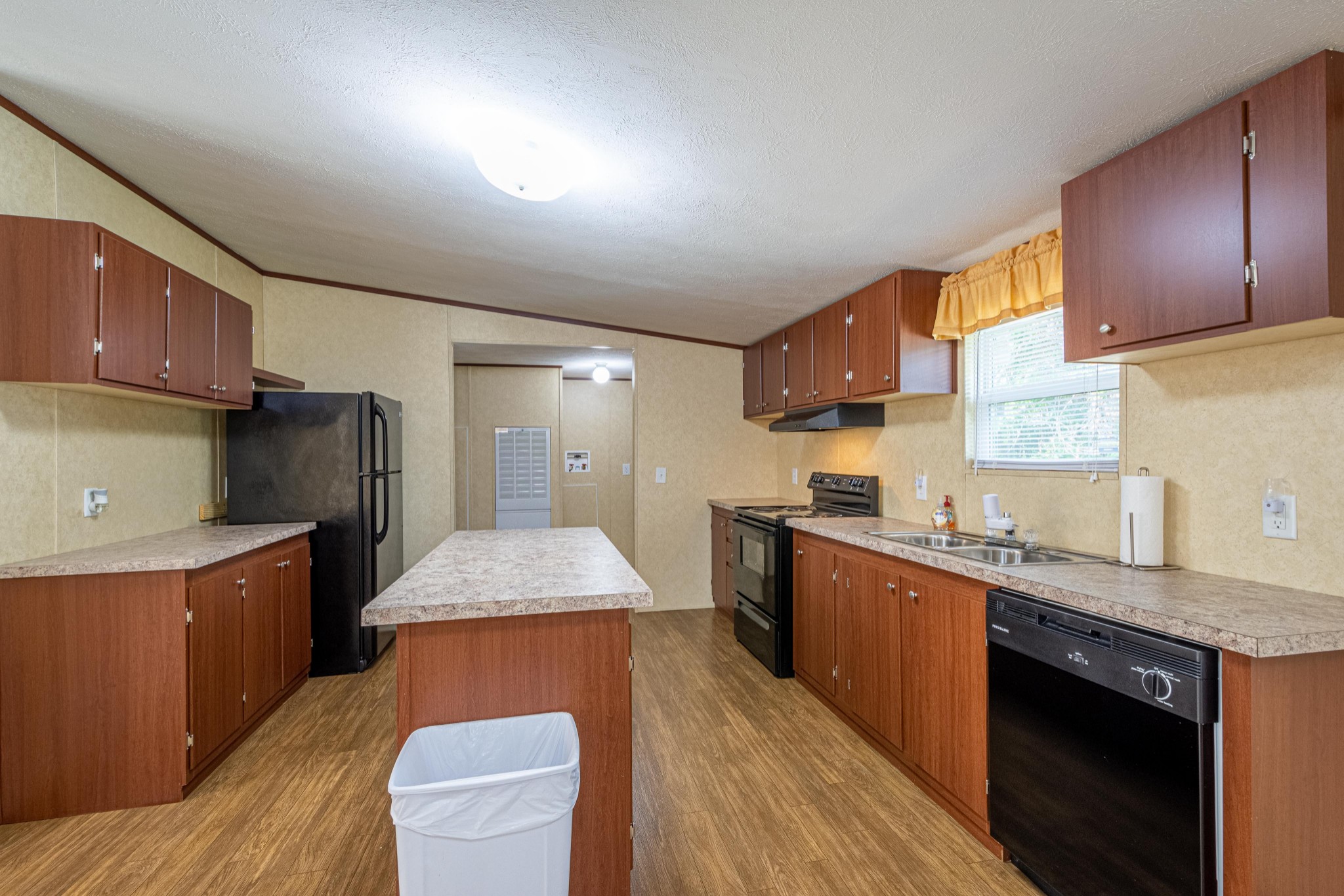 765 Crooked Hill Road Pulaski, TN 38478 - Photo 22 of 50 a kitchen with stainless steel appliances granite countertop wooden cabinets a sink dishwasher a stove and a refrigerator