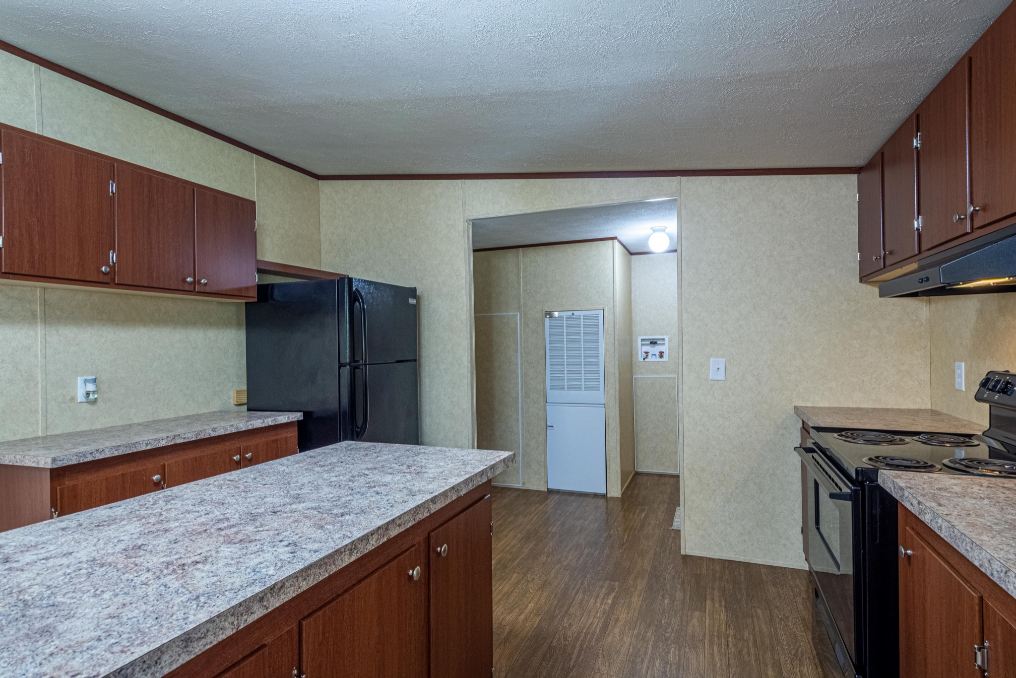 765 Crooked Hill Road Pulaski, TN 38478 - Photo 24 of 50 a kitchen with stainless steel appliances granite countertop a refrigerator a sink dishwasher a stove and wooden floors