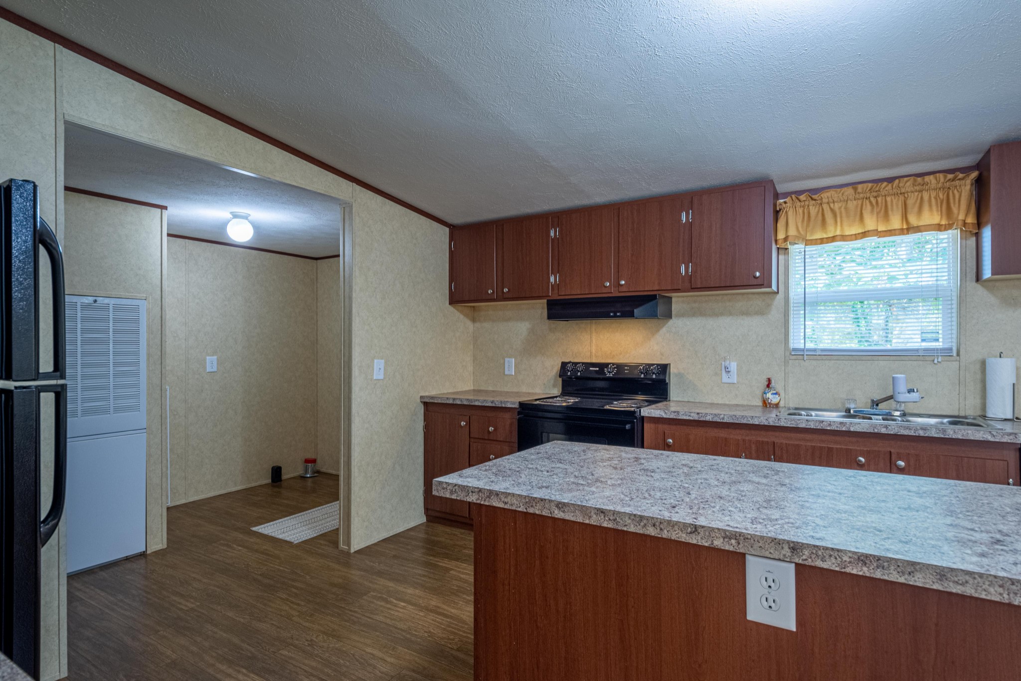 765 Crooked Hill Road Pulaski, TN 38478 - Photo 25 of 50 a kitchen with stainless steel appliances granite countertop a sink stove and refrigerator