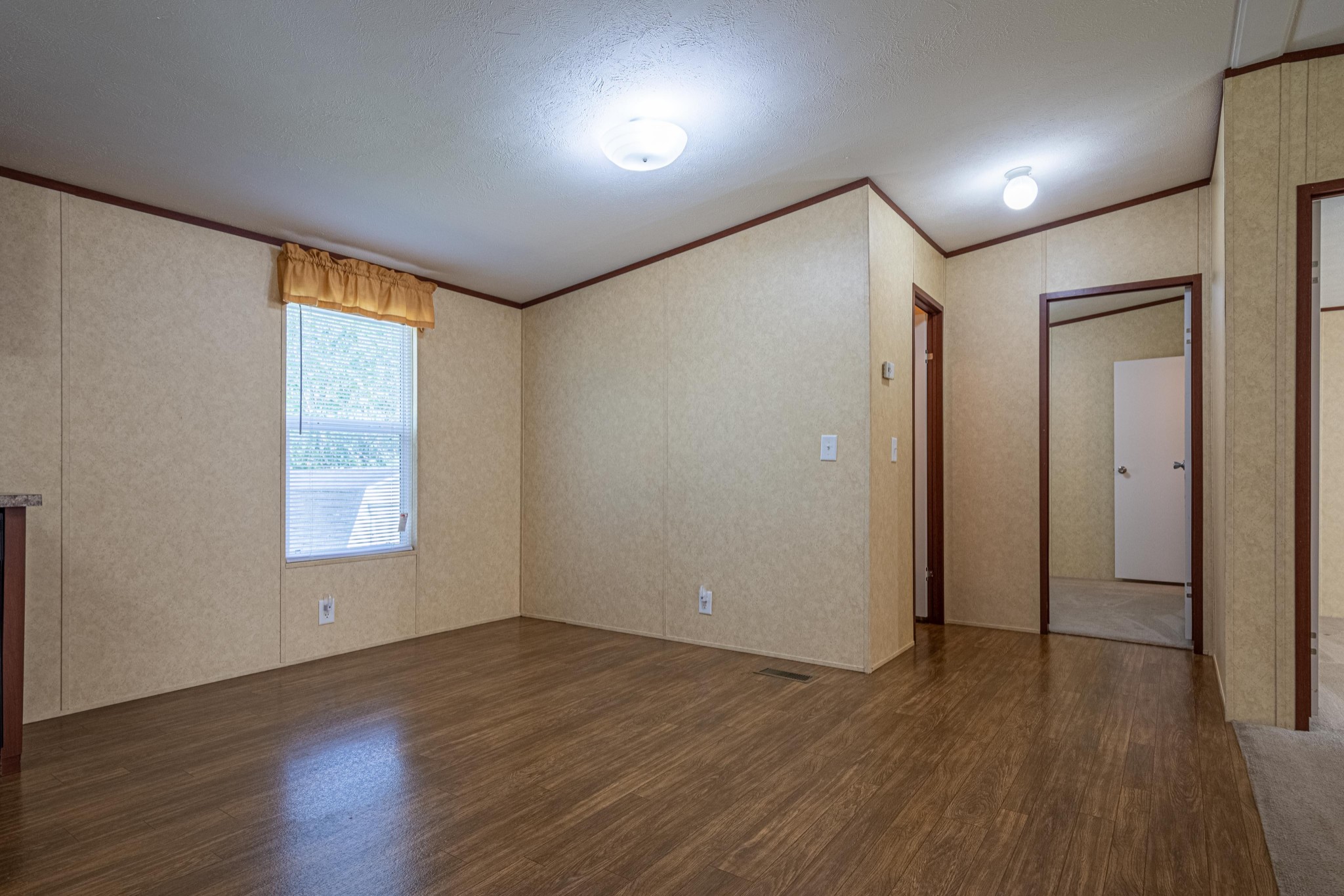 765 Crooked Hill Road Pulaski, TN 38478 - Photo 31 of 50 an empty room with wooden floor and windows