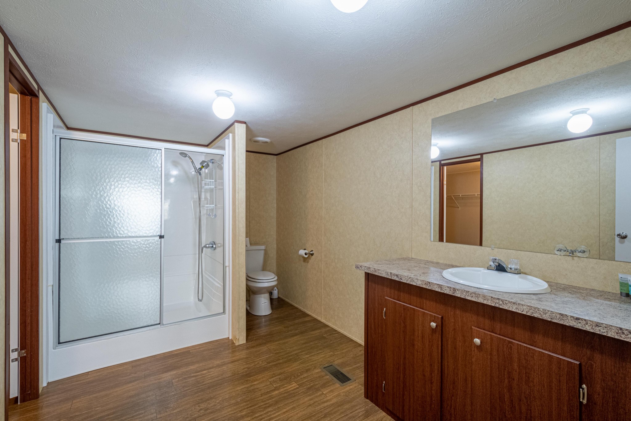 765 Crooked Hill Road Pulaski, TN 38478 - Photo 34 of 50 a bathroom with a granite countertop sink mirror and shower