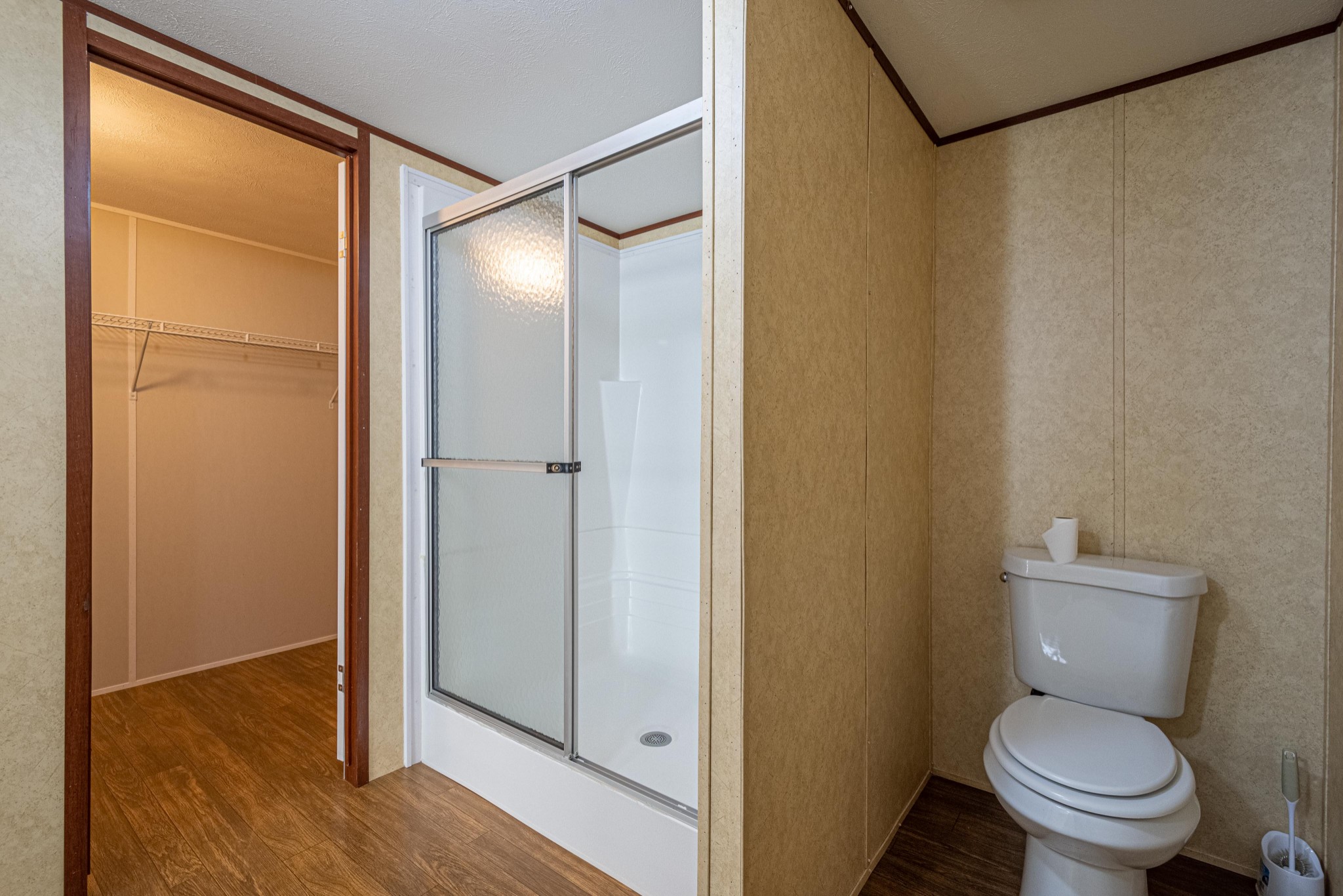 765 Crooked Hill Road Pulaski, TN 38478 - Photo 35 of 50 a bathroom with a granite countertop toilet and a shower