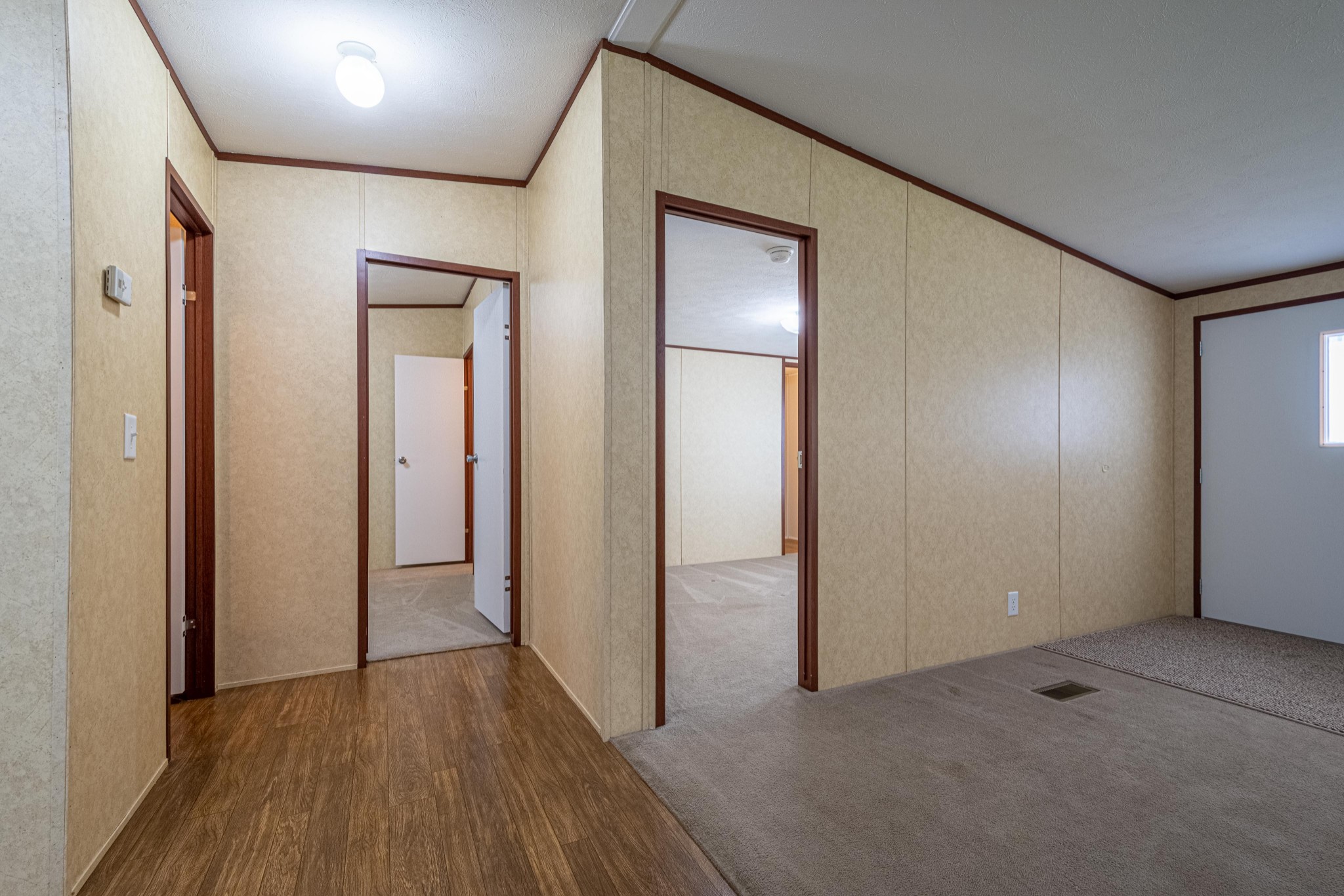 765 Crooked Hill Road Pulaski, TN 38478 - Photo 40 of 50 an empty room with wooden floor and windows