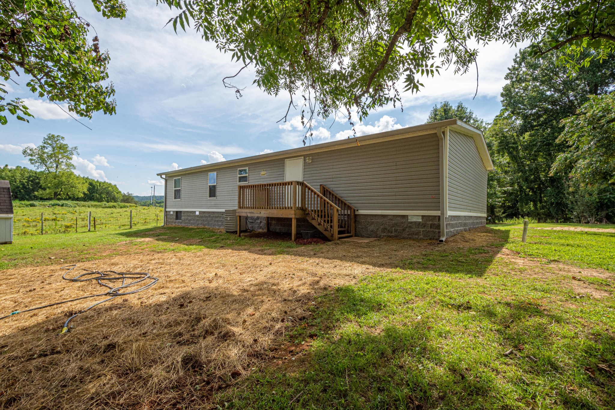 765 Crooked Hill Road Pulaski, TN 38478 - Photo 6 of 50 a view of a house with backyard and garden