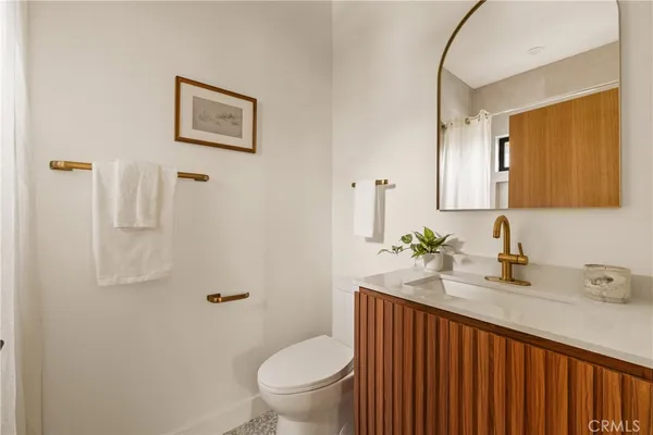 a bathroom with a sink toilet and vanity