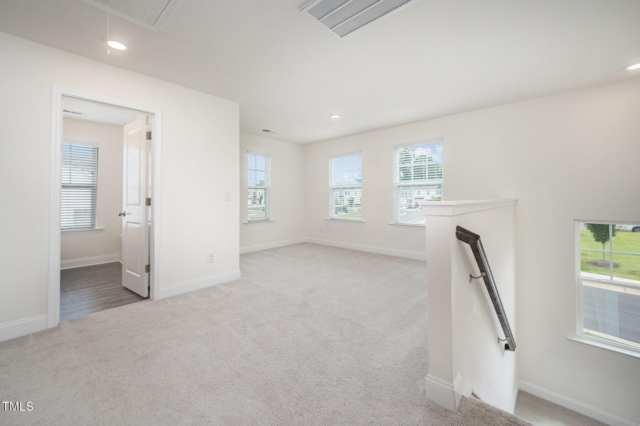 80 Nailsworth Street Angier, NC 27501 - Photo 11 of 29 wooden floor in an empty room with a window