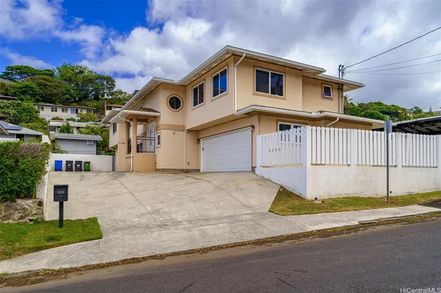 a front view of a house with a garage