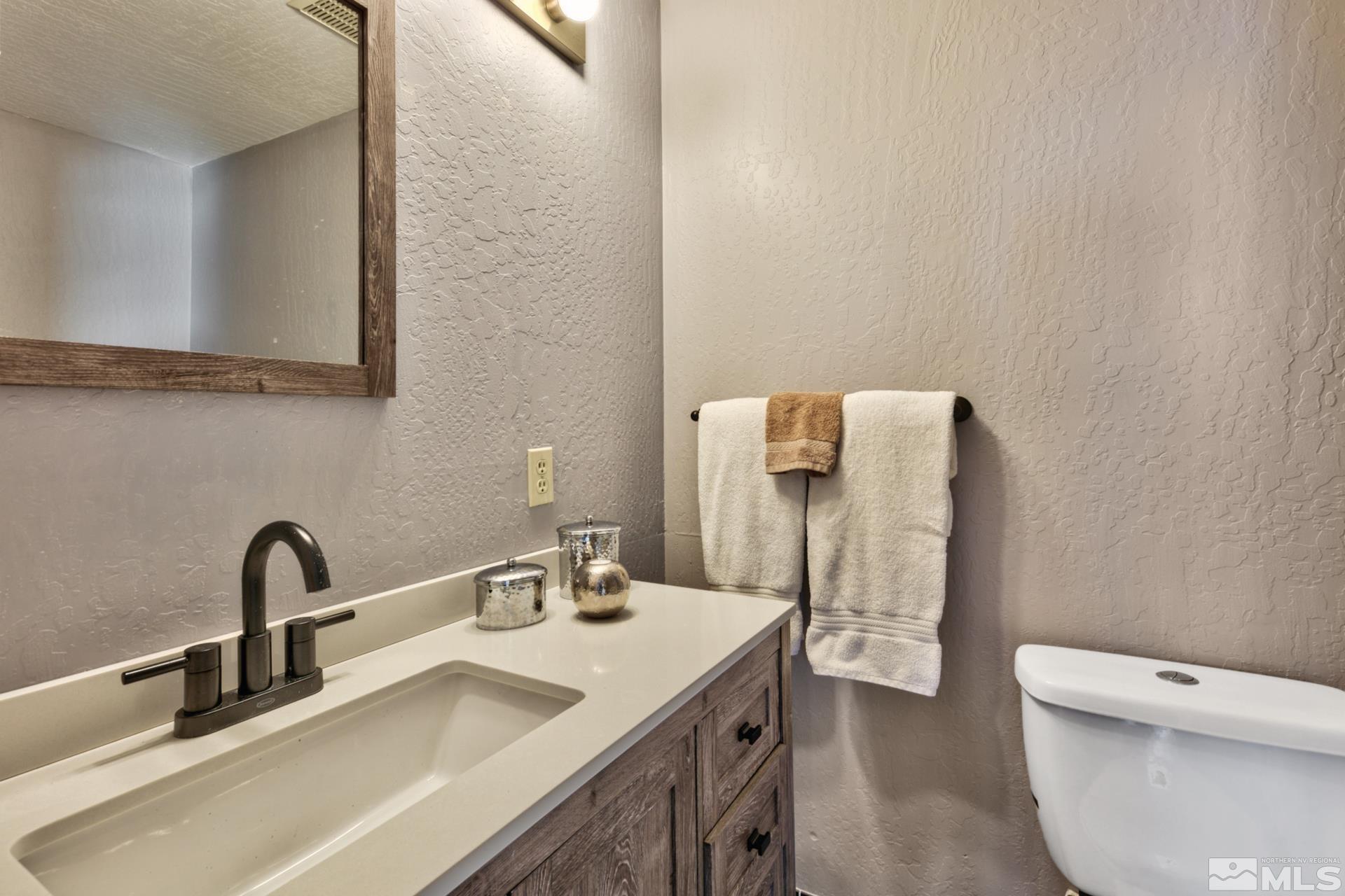 313 Tramway Drive, Unit 4 Stateline, NV 89449 - Photo 14 of 26 a bathroom with a sink and a toilet