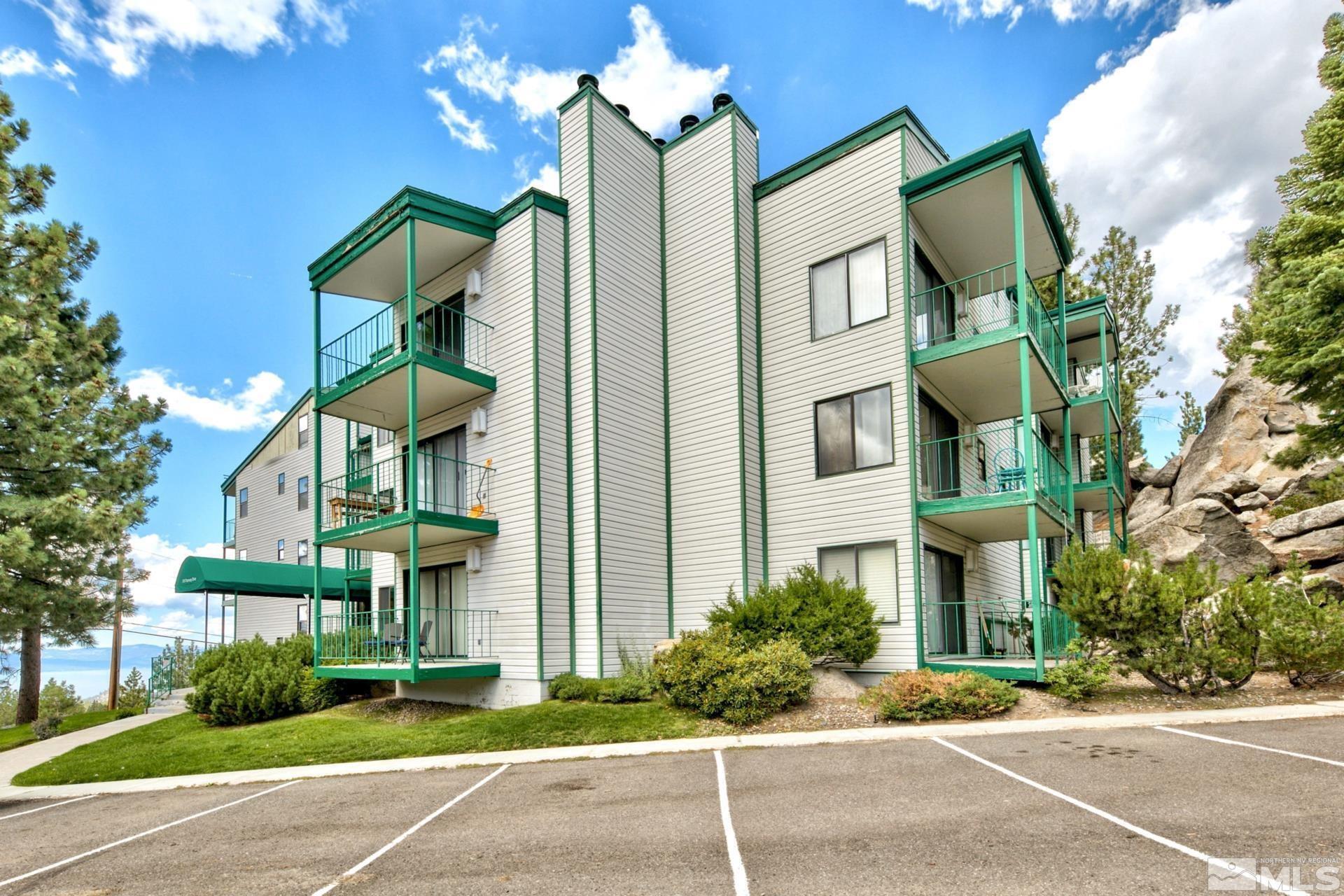 313 Tramway Drive, Unit 4 Stateline, NV 89449 - Photo 18 of 26 a front view of a multi story residential apartment building with a yard