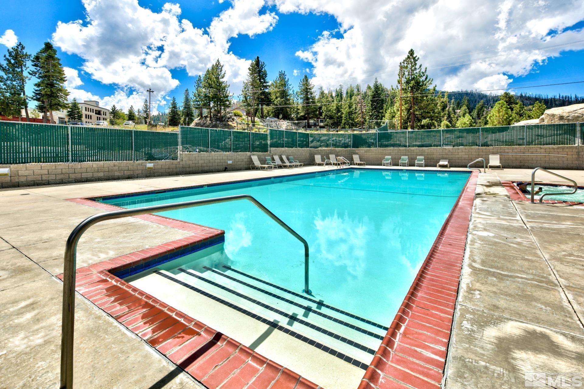 313 Tramway Drive, Unit 4 Stateline, NV 89449 - Photo 21 of 26 a view of swimming pool with a bench in the background