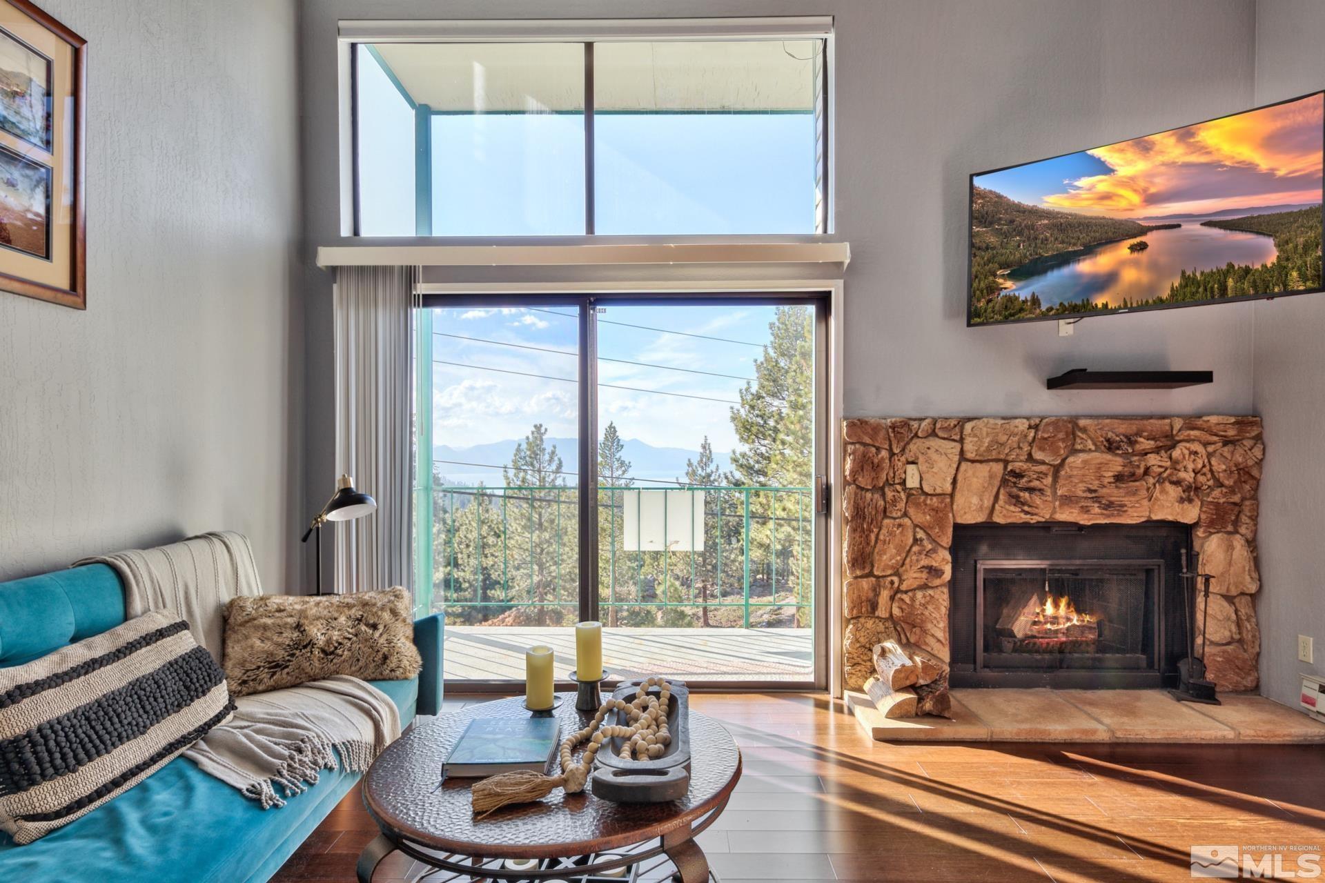 313 Tramway Drive, Unit 4 Stateline, NV 89449 - Photo 5 of 26 a living room with furniture and a fireplace