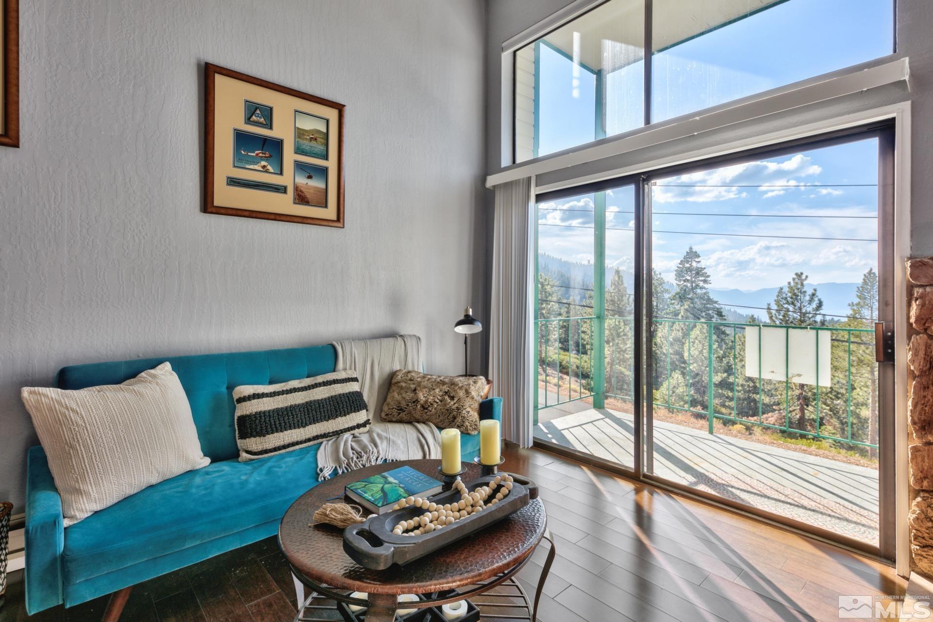 313 Tramway Drive, Unit 4 Stateline, NV 89449 - Photo 6 of 26 a living room with furniture and a floor to ceiling window