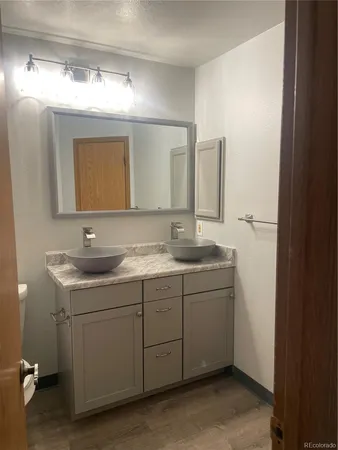 a bathroom with a double vanity sink and mirror