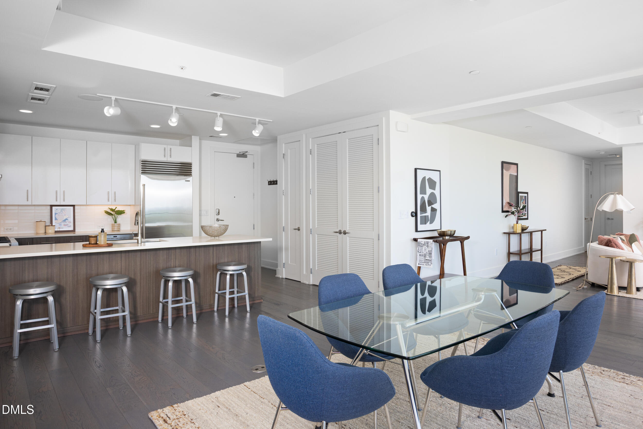 110 Corcoran Street, Unit 2603 Durham, NC 27701 - Photo 14 of 57 a dining room with furniture and wooden floor
