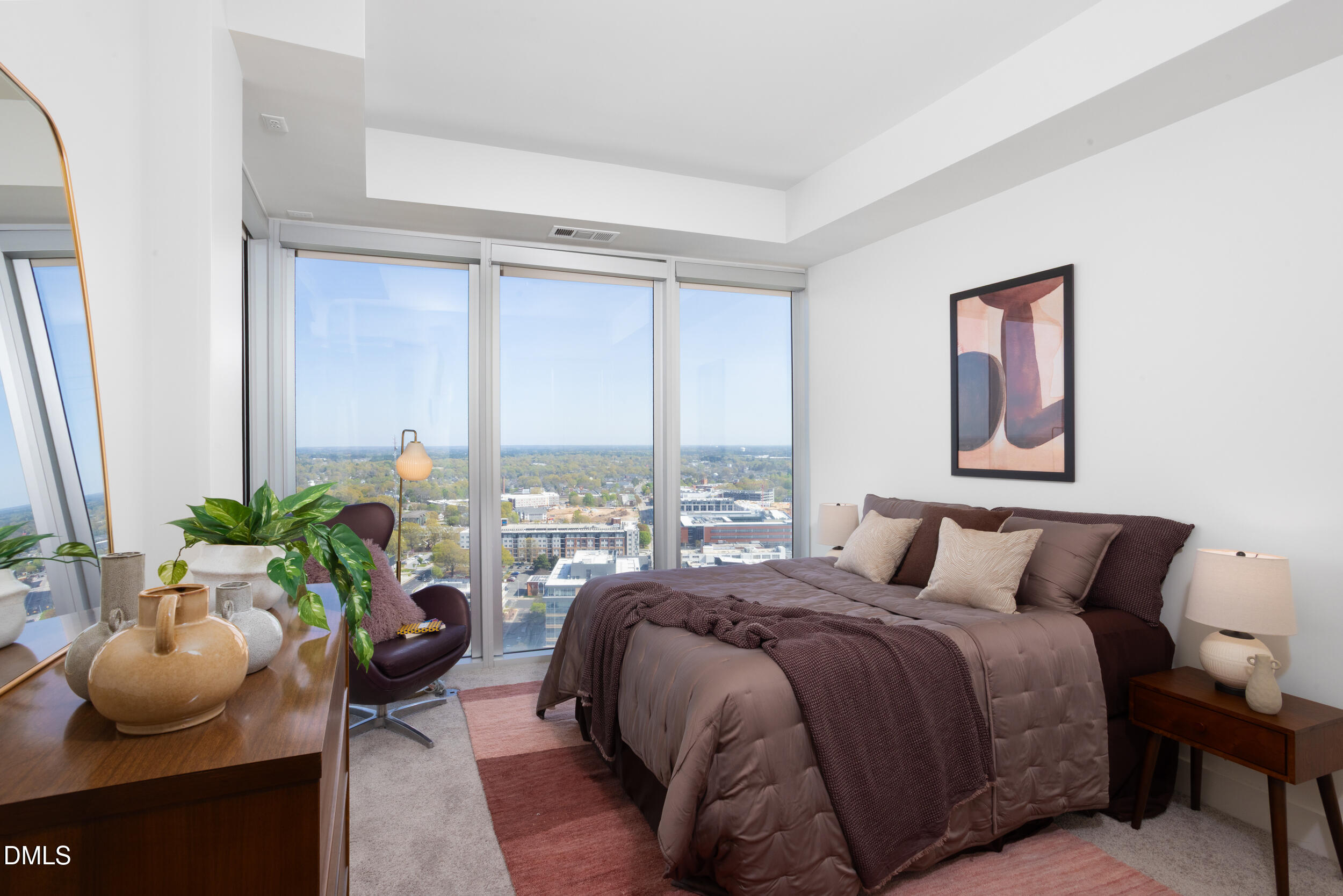 110 Corcoran Street, Unit 2603 Durham, NC 27701 - Photo 17 of 57 a bedroom with a bed and large windows