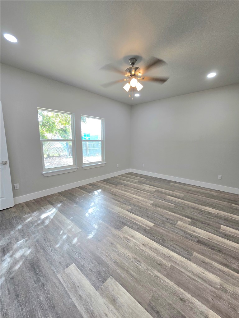 829 Utica Street Corpus Christi, TX 78418 - Photo 5 of 12 a view of an empty room with a window