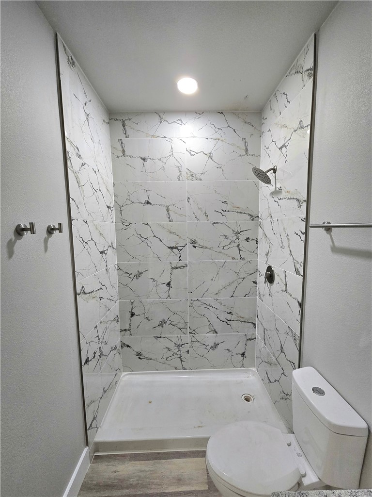 829 Utica Street Corpus Christi, TX 78418 - Photo 8 of 12 a bathroom with a toilet and a shower