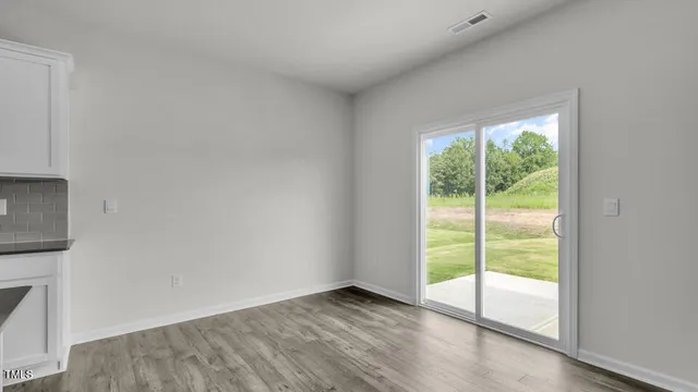 a view of an empty room and window