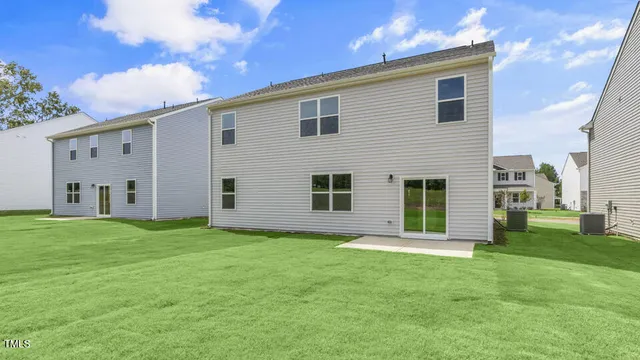 a view of a backyard of the house