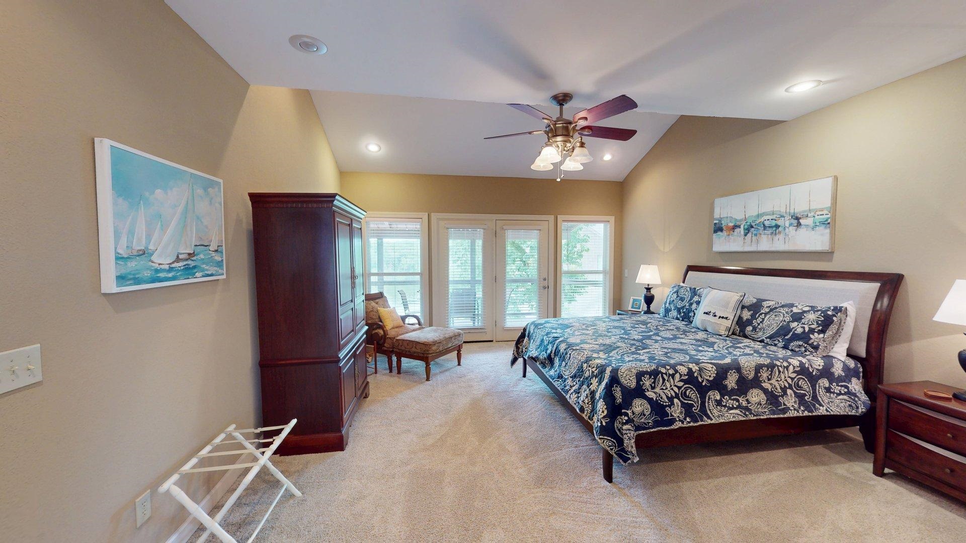 1085 Caney Hollow Road Counce, TN 38326 - Photo 11 of 39 Bedroom with light colored carpet, access to outside, vaulted ceiling, a ceiling fan, and recessed lighting
