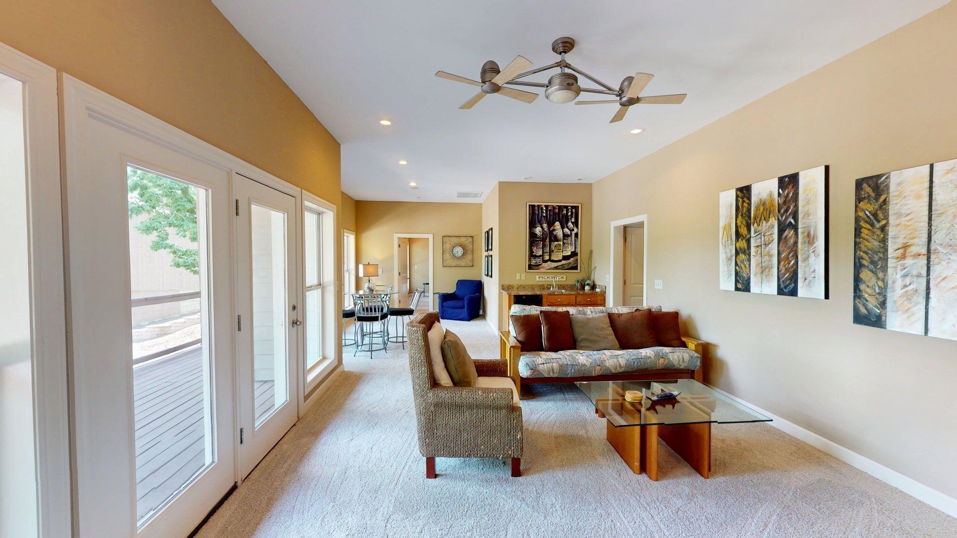 1085 Caney Hollow Road Counce, TN 38326 - Photo 17 of 39 Living area with light colored carpet, baseboards, a ceiling fan, recessed lighting, and french doors