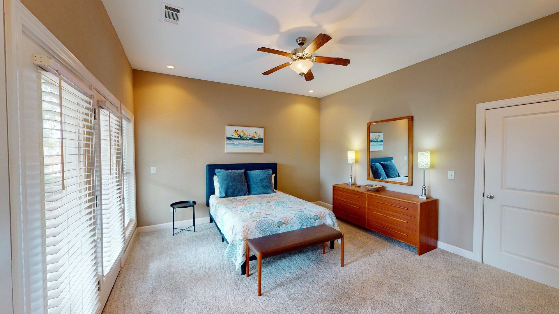 1085 Caney Hollow Road Counce, TN 38326 - Photo 21 of 39 a bedroom with a bed and a chandelier