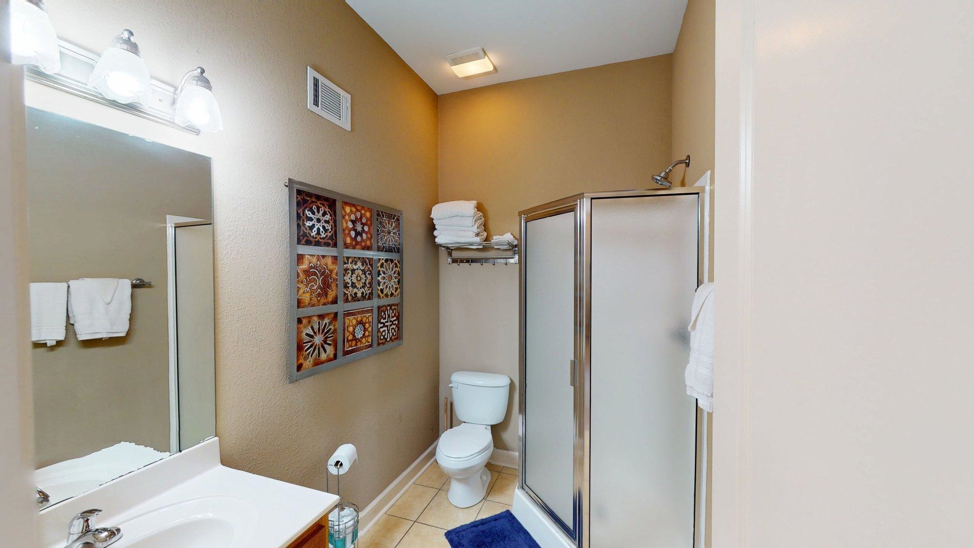 1085 Caney Hollow Road Counce, TN 38326 - Photo 23 of 39 a bathroom with a granite countertop toilet and a shower