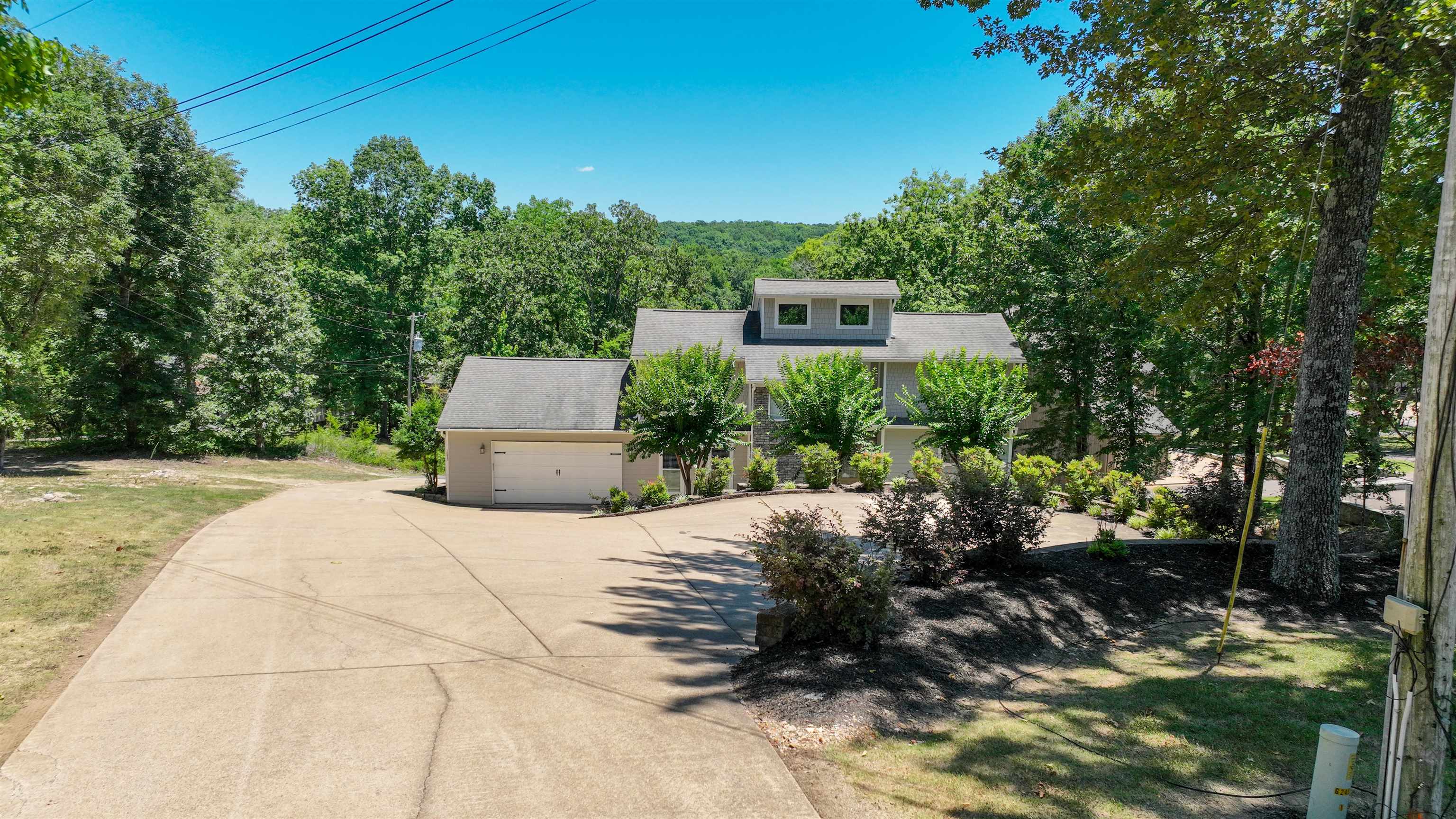 1085 Caney Hollow Road Counce, TN 38326 - Photo 37 of 39 View of front of home featuring a garage and a front yard