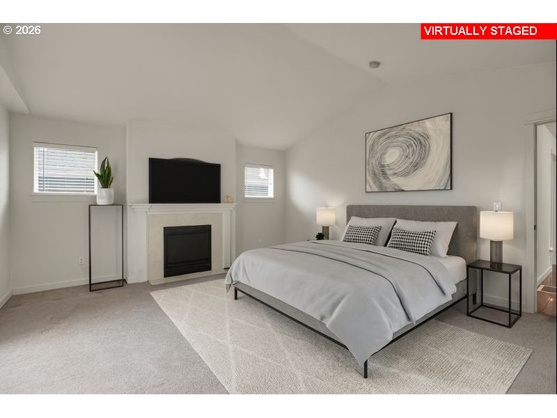 7110 Southwest Queen Lane Beaverton, OR 97008 - Photo 15 of 18 a spacious bedroom with a bed and a television