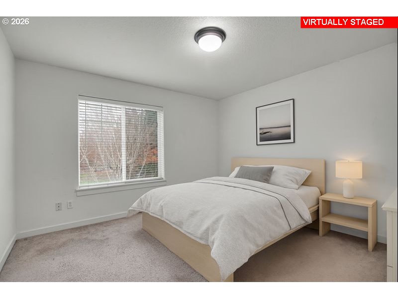 7110 Southwest Queen Lane Beaverton, OR 97008 - Photo 16 of 18 a bedroom with a bed and a window