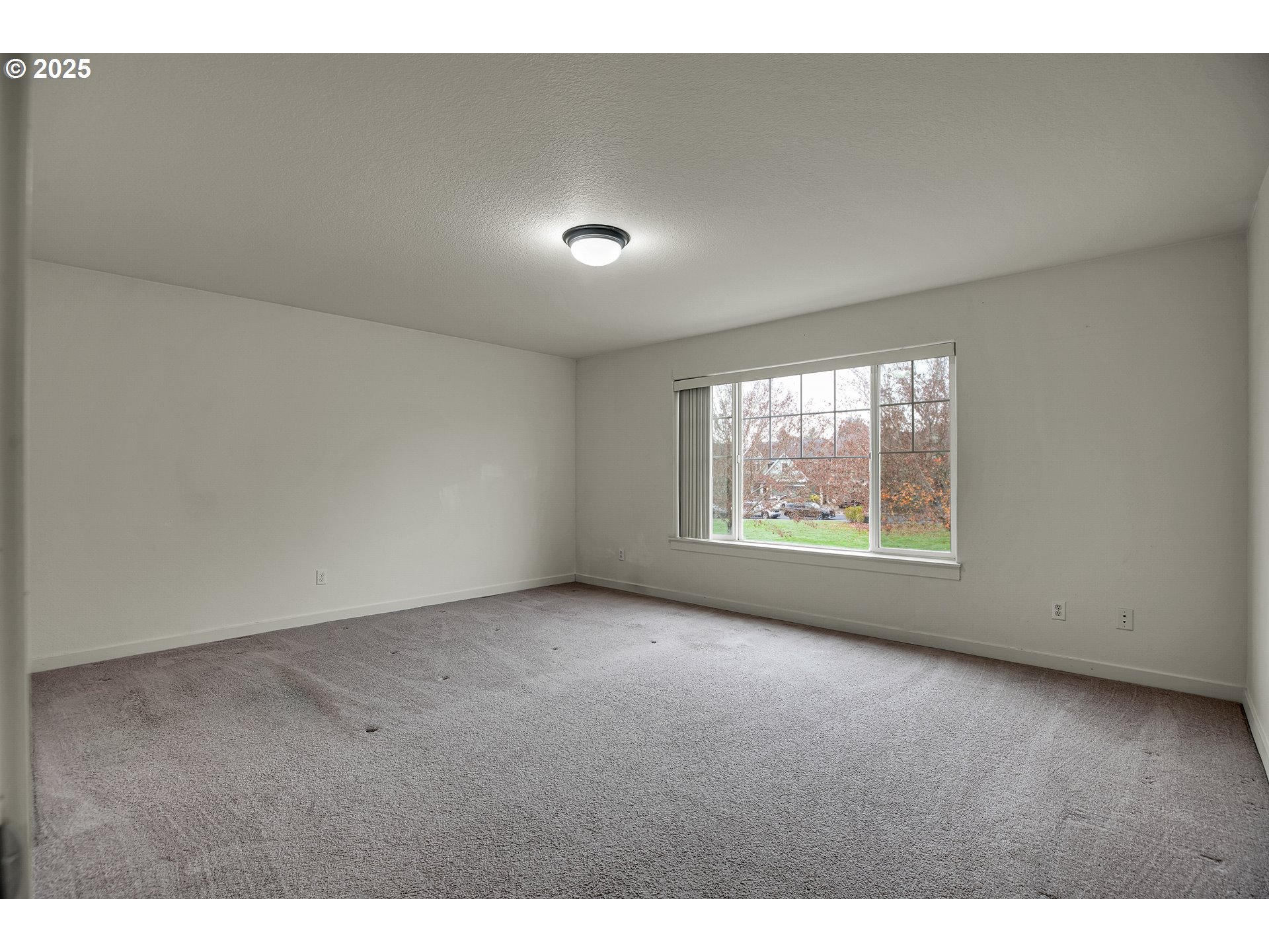 7110 Southwest Queen Lane Beaverton, OR 97008 - Photo 10 of 18 a view of an empty room with a window