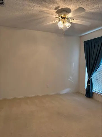 a view of a ceiling fan and a chandelier fan