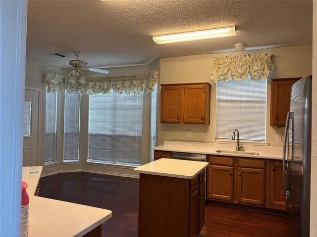 a bathroom with a sink a vanity and a large mirror