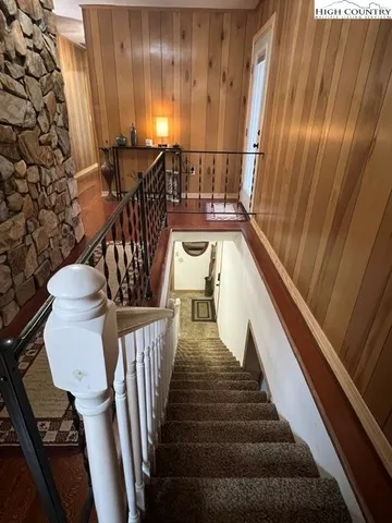 a view of hallway with walk in closet and bathroom