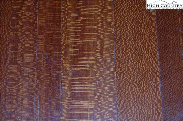 a living room with furniture pool table and a fireplace