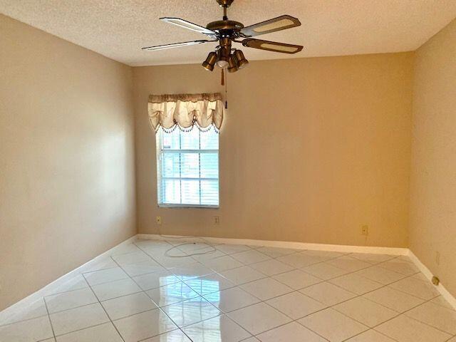 9095 Flynn Circle, Unit 6 Boca Raton, FL 33496 - Photo 11 of 19 a view of a room with window and a chandelier