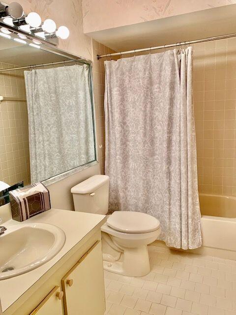 9095 Flynn Circle, Unit 6 Boca Raton, FL 33496 - Photo 13 of 19 a bathroom with a toilet sink and shower