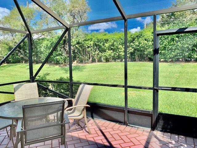 9095 Flynn Circle, Unit 6 Boca Raton, FL 33496 - Photo 14 of 19 a view of a two chair in the patio