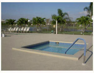 9095 Flynn Circle, Unit 6 Boca Raton, FL 33496 - Photo 18 of 19 a view of outdoor space swimming pool and lake view