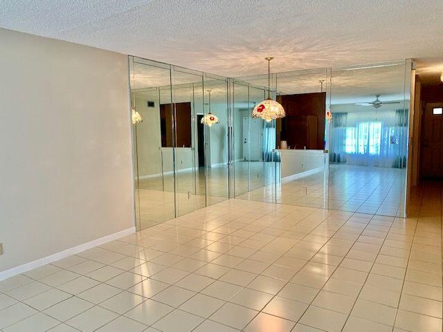 9095 Flynn Circle, Unit 6 Boca Raton, FL 33496 - Photo 8 of 19 a view of a room window and wooden floor